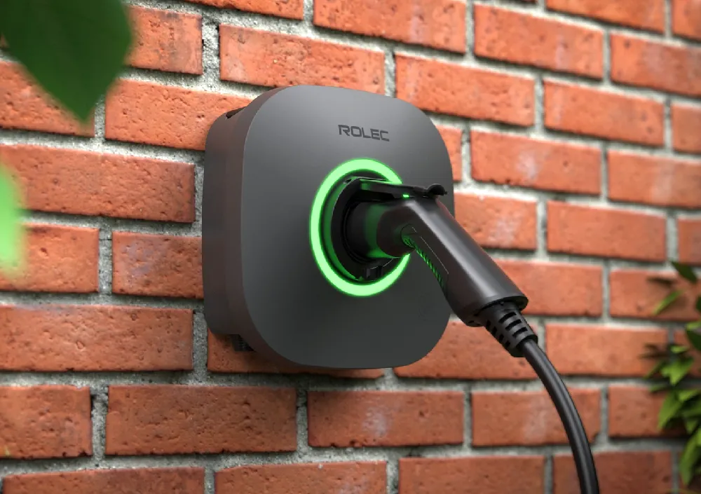 Rolec EVO smart EV charger installed on a brick wall.